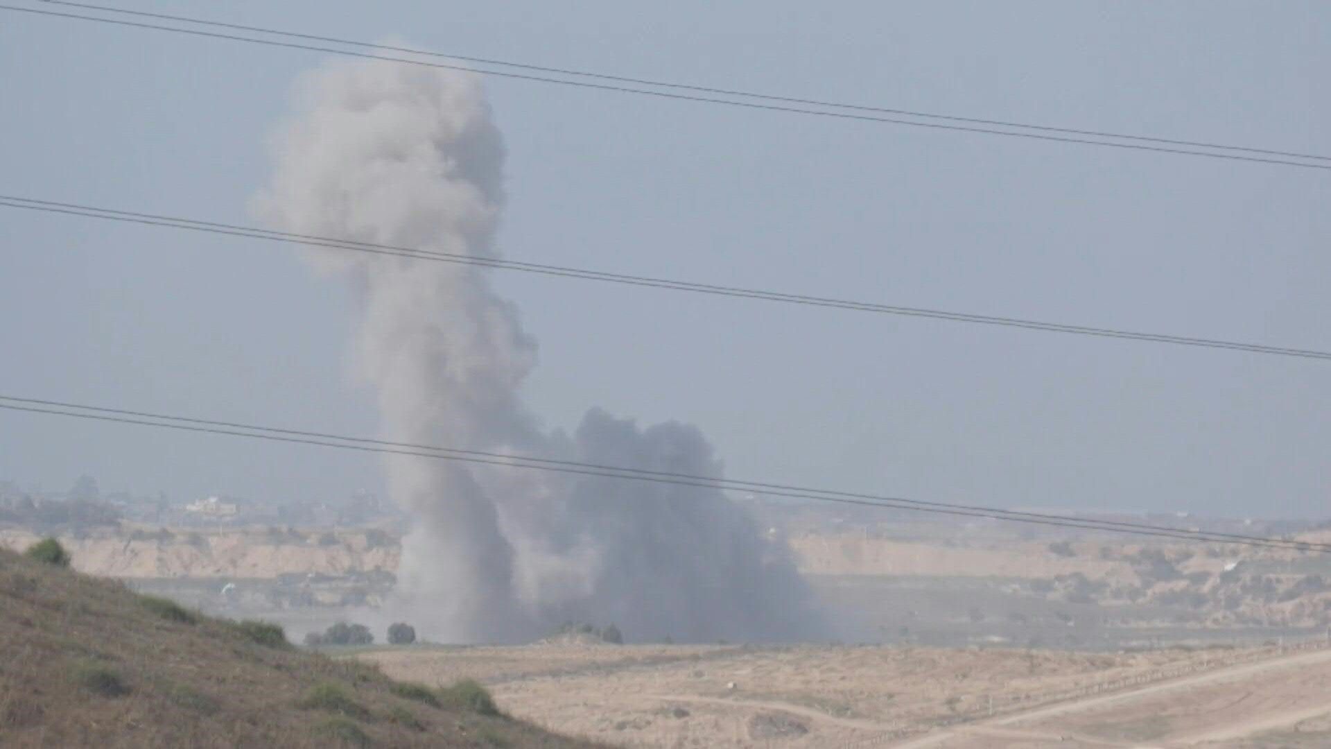 Israeli tanks on Gaza-Israel border as smoke rises after strikes
