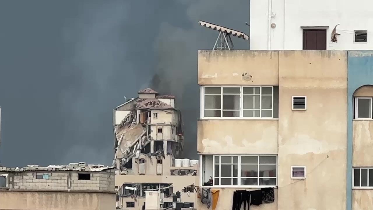 Smoke rises from destroyed building after strikes in Gaza City
