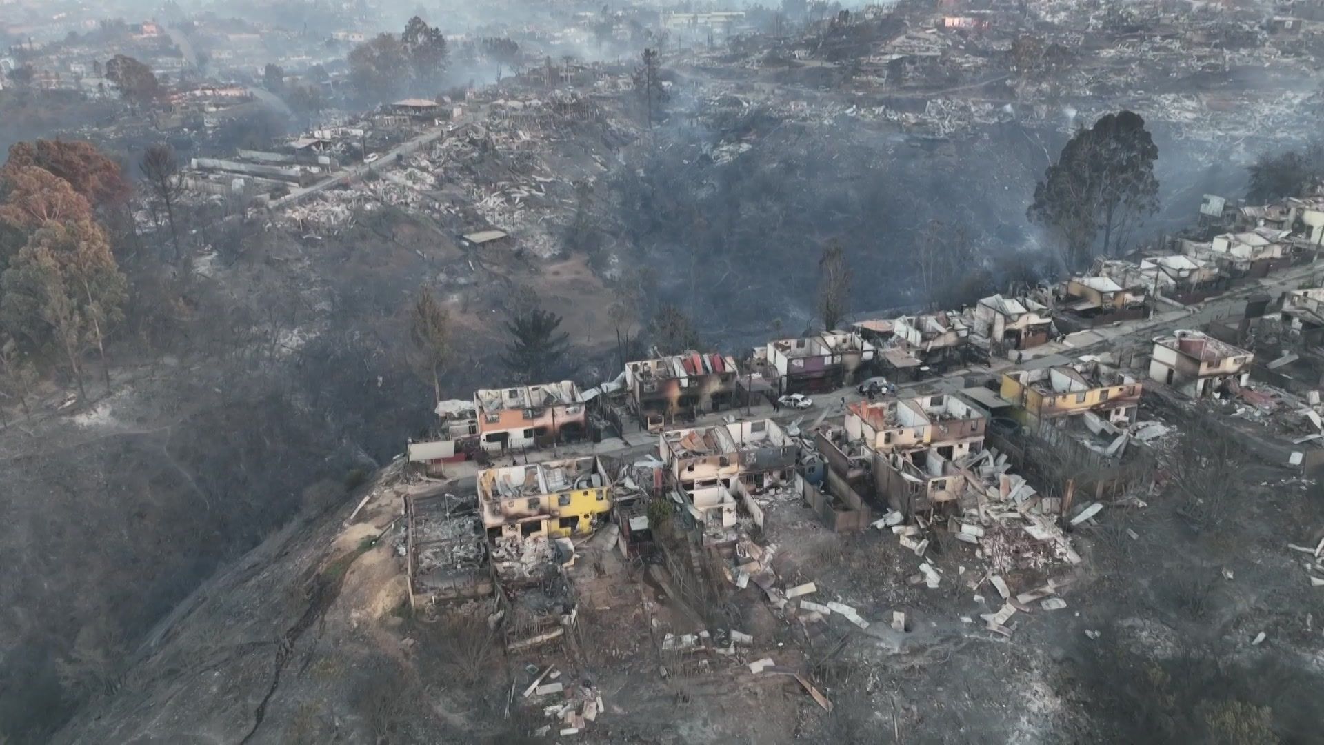 Burnt houses after wildfire in Chile that leave at least 19 dead