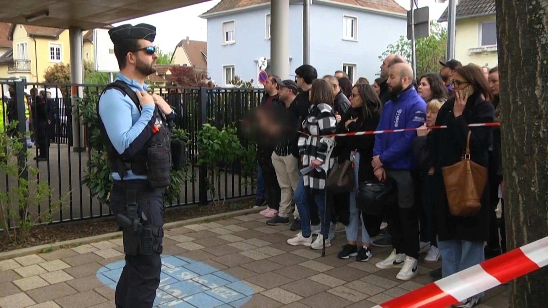 Parents wait to pick-up children from French school near knife attack site