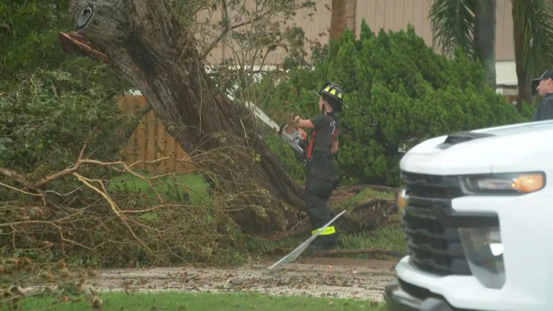 Hurricane Milton aftermath: Firefighters clear trees in Cocoa Beach cleanup
