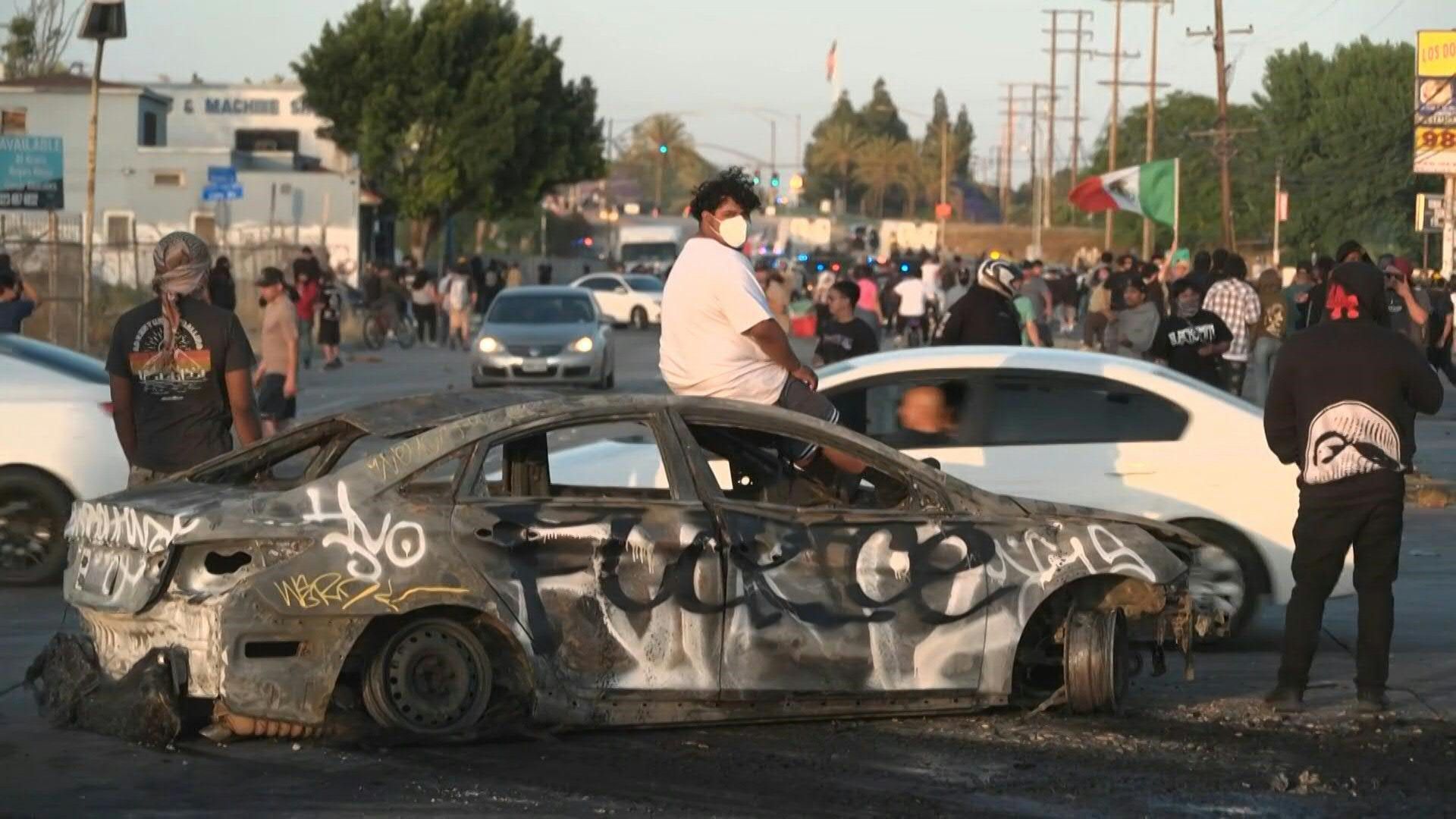 US-demonstrators-protest-immigration-enforcement-raids-in-Los-Angeles-suburb