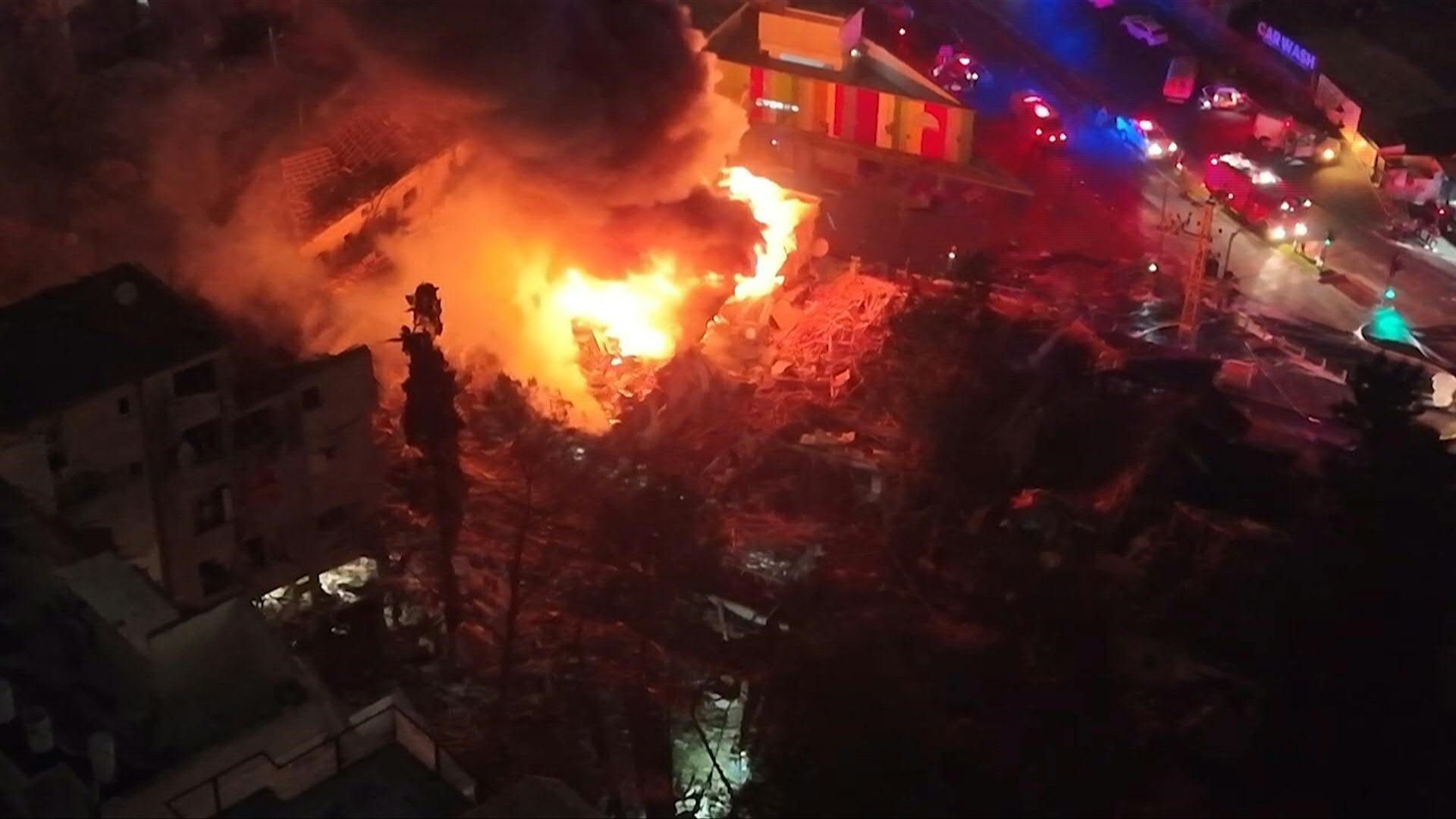 Video: AERIAL: Fire blazes as responders deployed at site of Iranian strike in central Israel