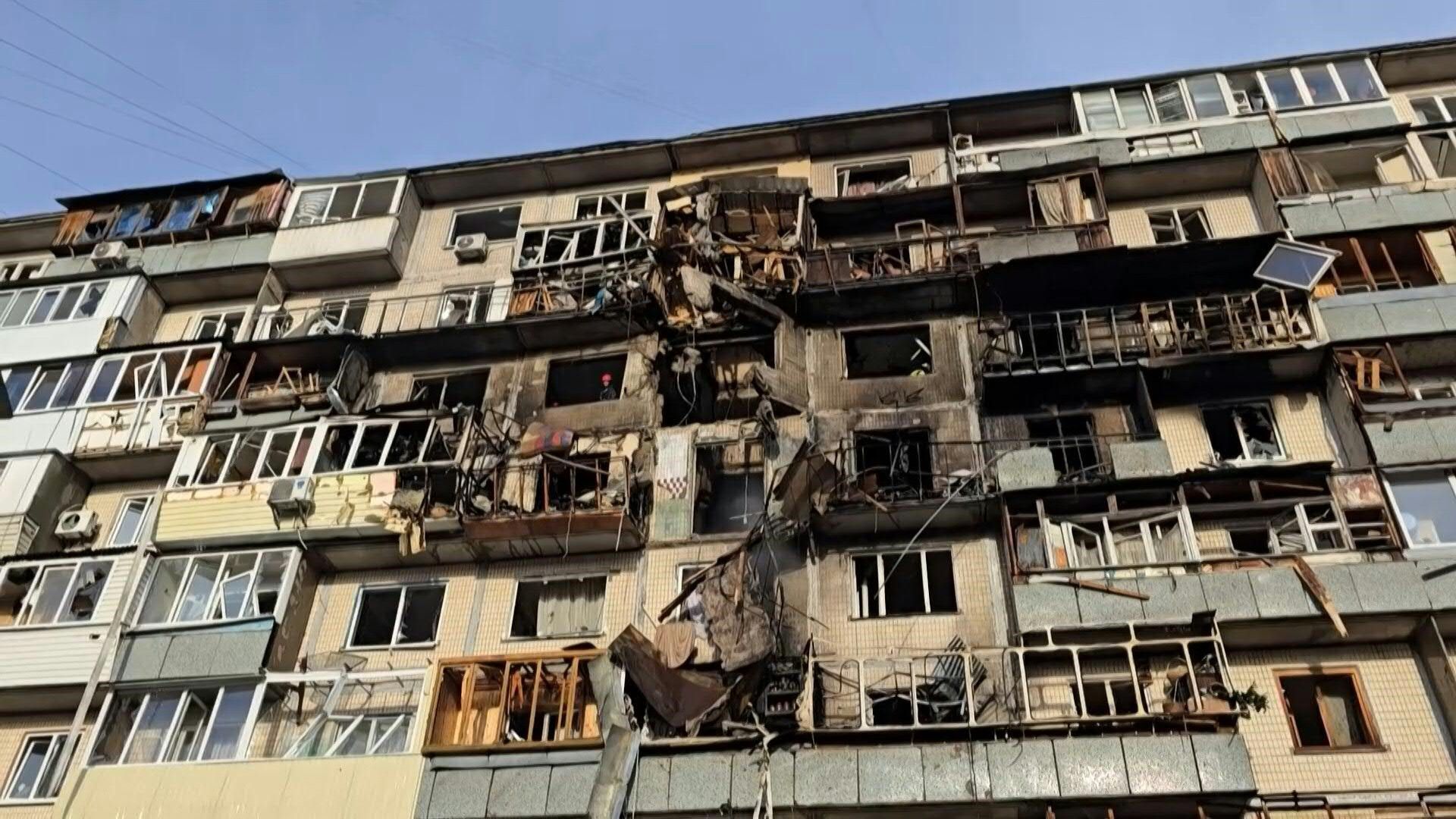 Ukrainians clear debris after deadly Russian attack on Kyiv