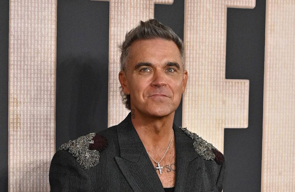 Robbie Williams eager to open for Oasis
