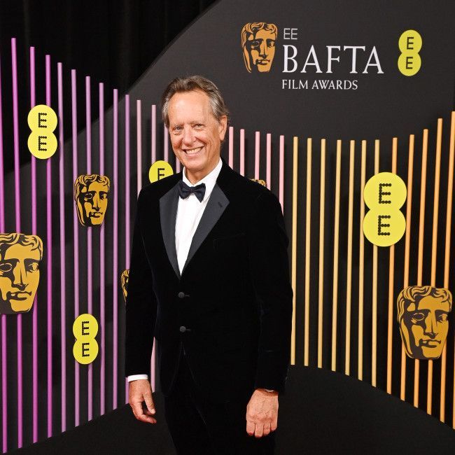 Richard E. Grant is happy with travelling solo