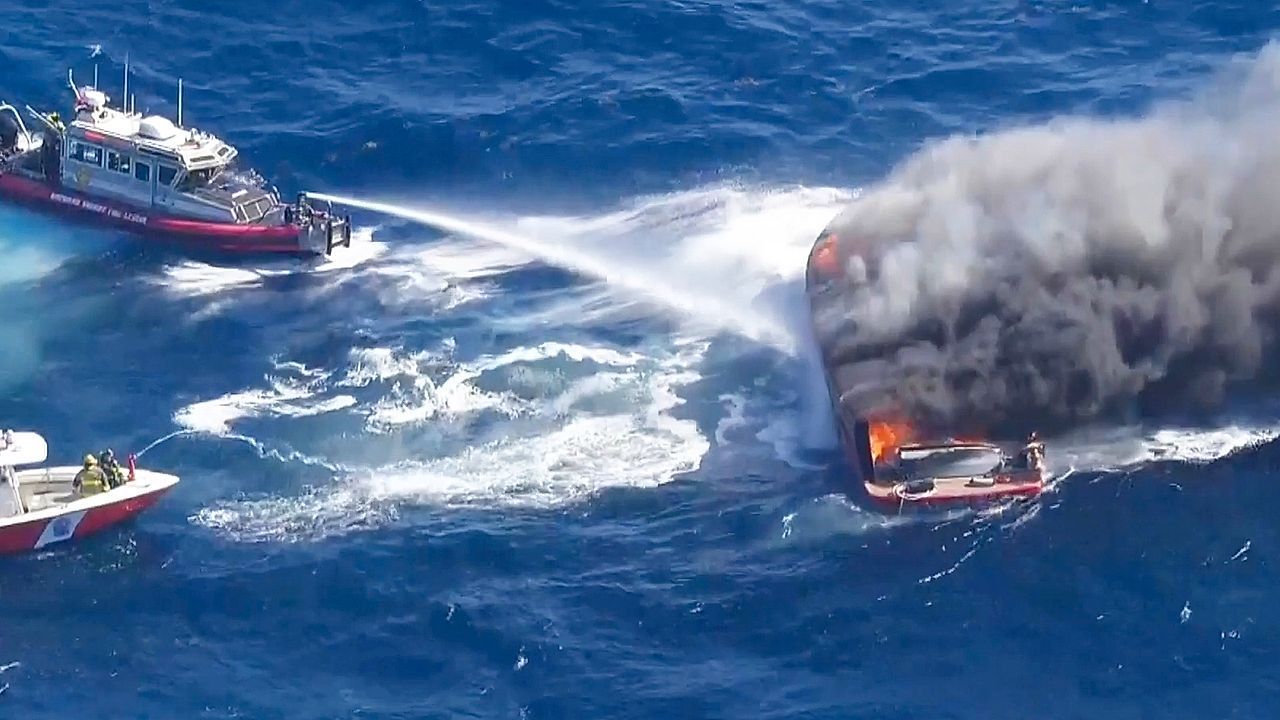 Massive fire destroys boat off Florida coast, two rescued
