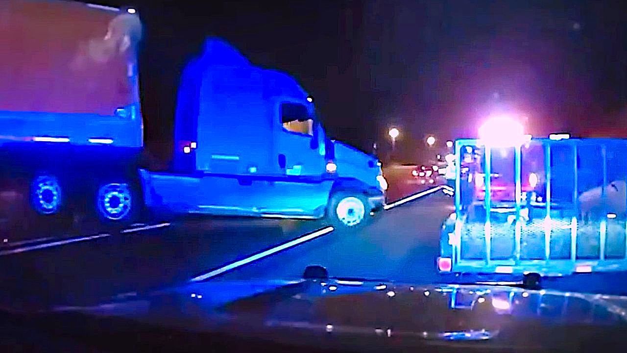 Officers narrowly escape crash after car forced under tractor trailer in Georgia
