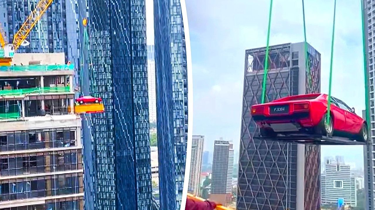 Locals-baffled-as-vintage-Ferrari-hoisted-into-high-rise-under-construction
