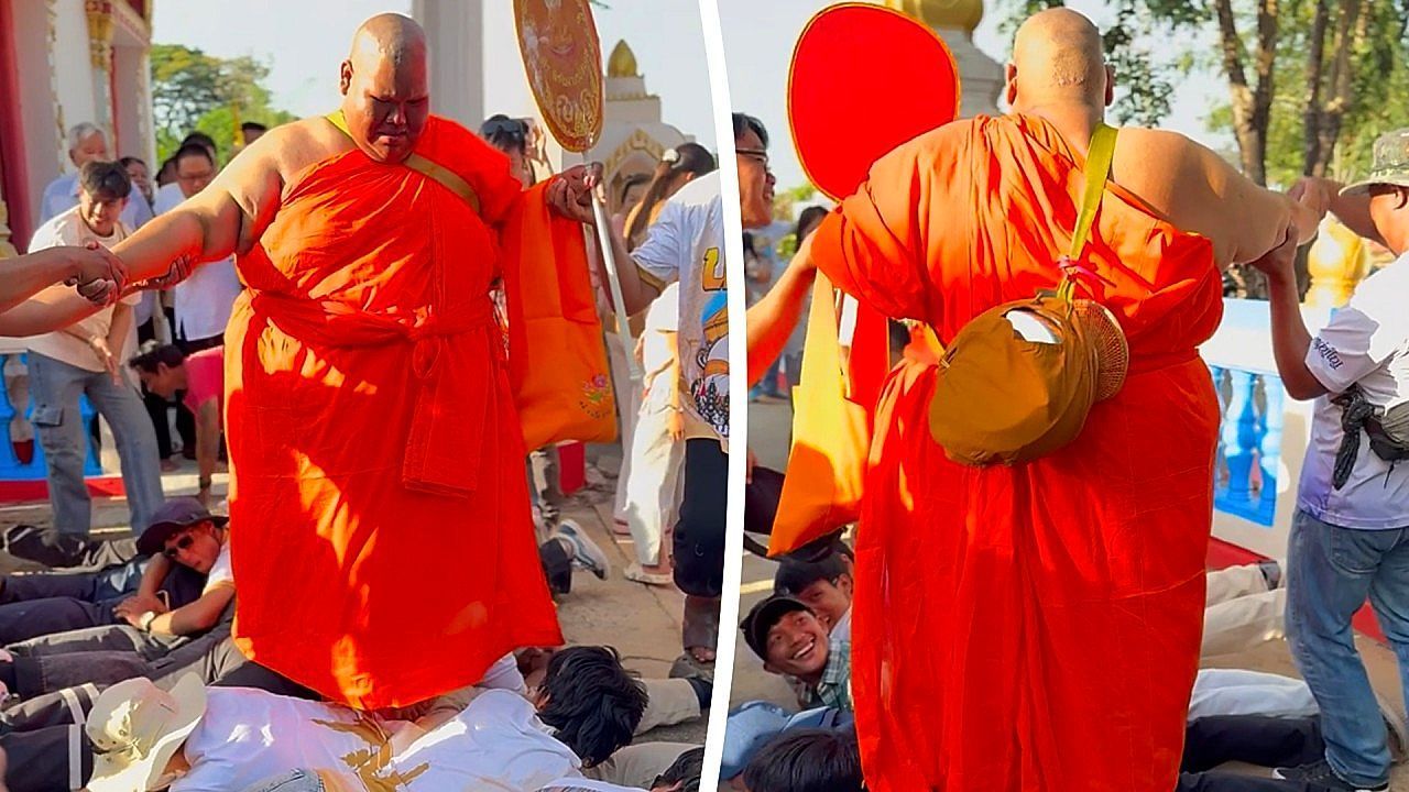 Monk-walks-across-worshippers-backs-during-intense-blessing-ritual