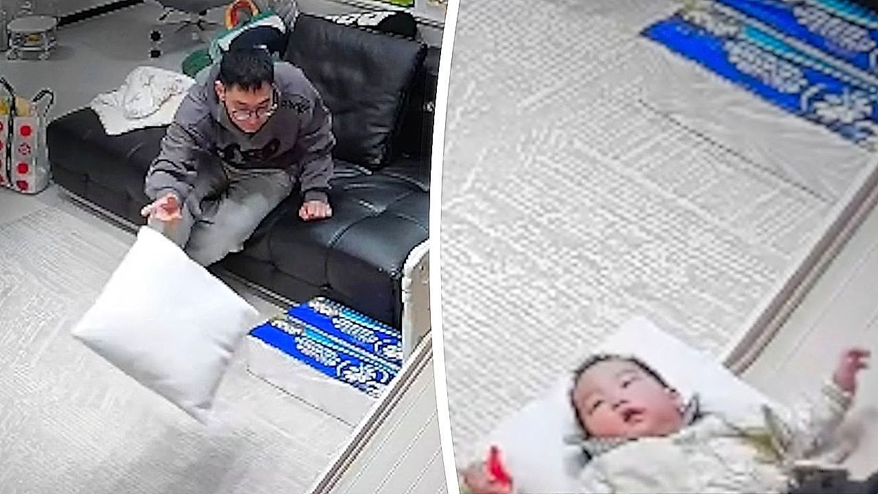 Nonchalant-father-saves-toddler-from-hard-fall-out-pure-instinct
