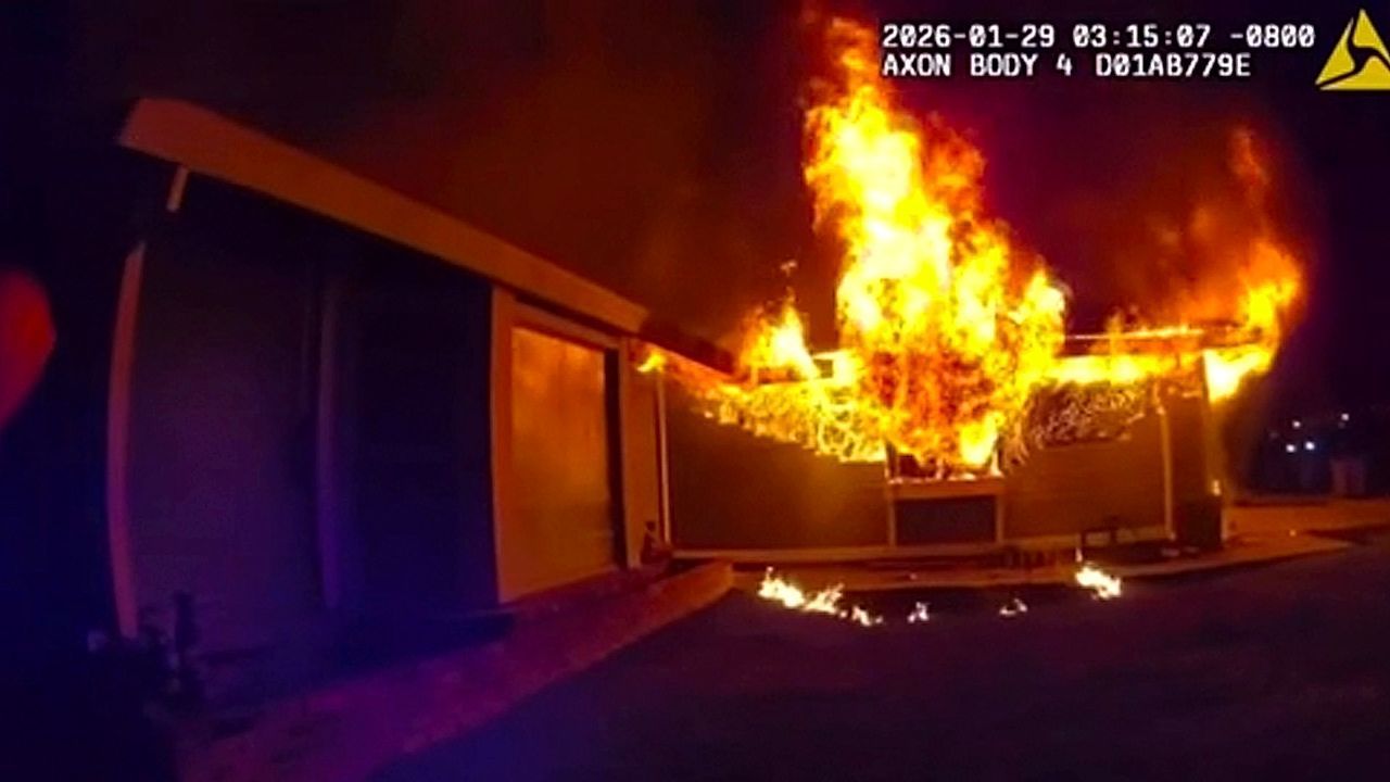 Video: Police save woman from burning home in California