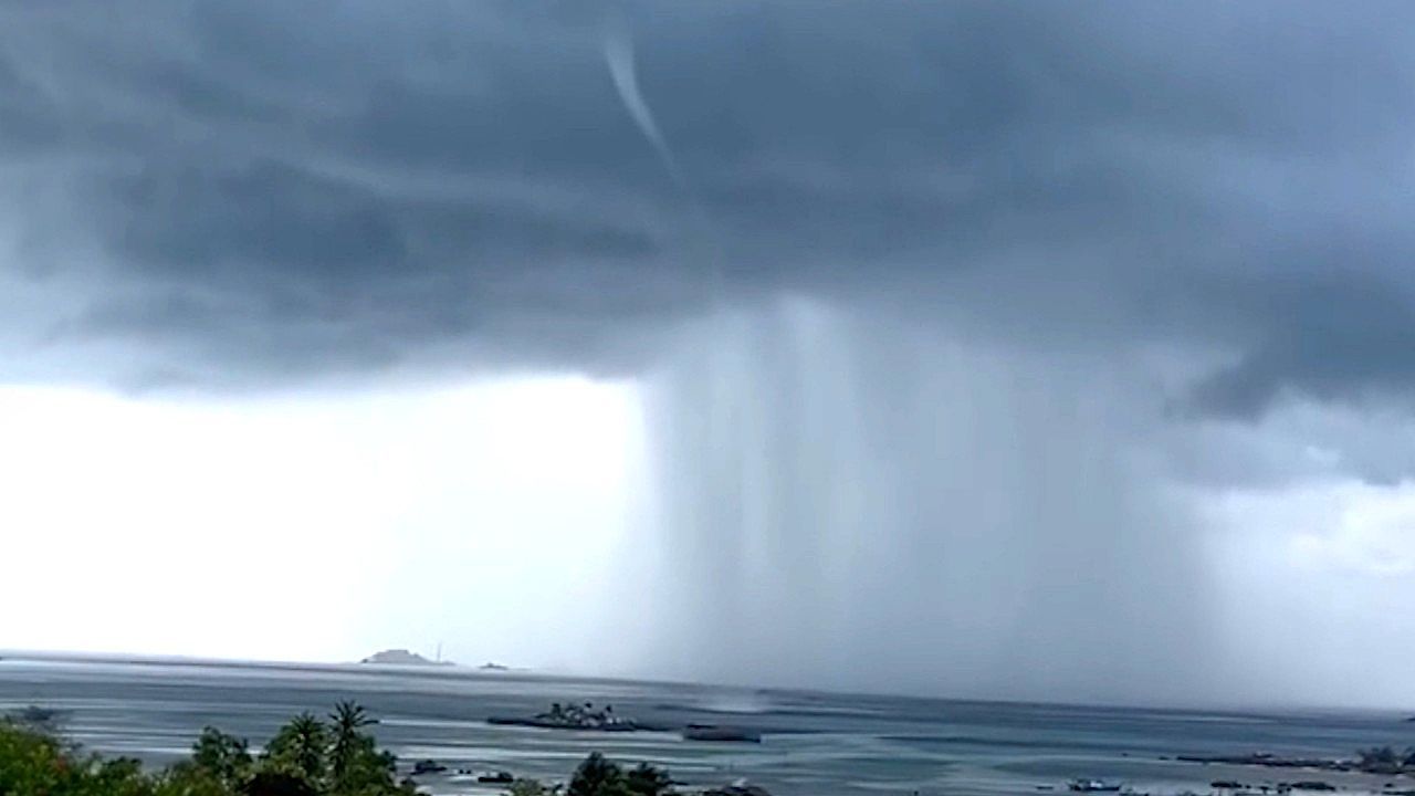 Video: Massive funnel forms offshore as storm churns near coastline