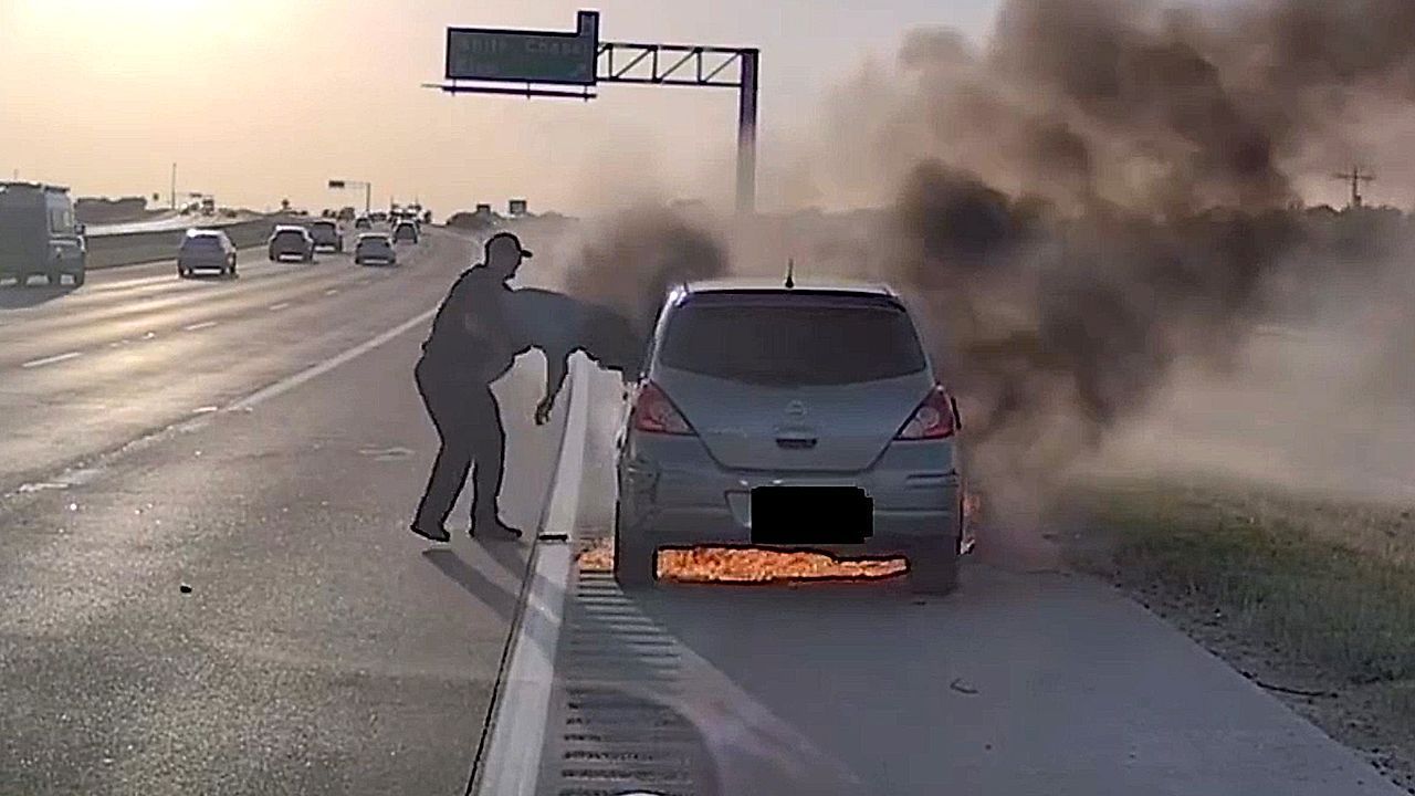 Video: Officer pulls driver from burning vehicle on Texas highway