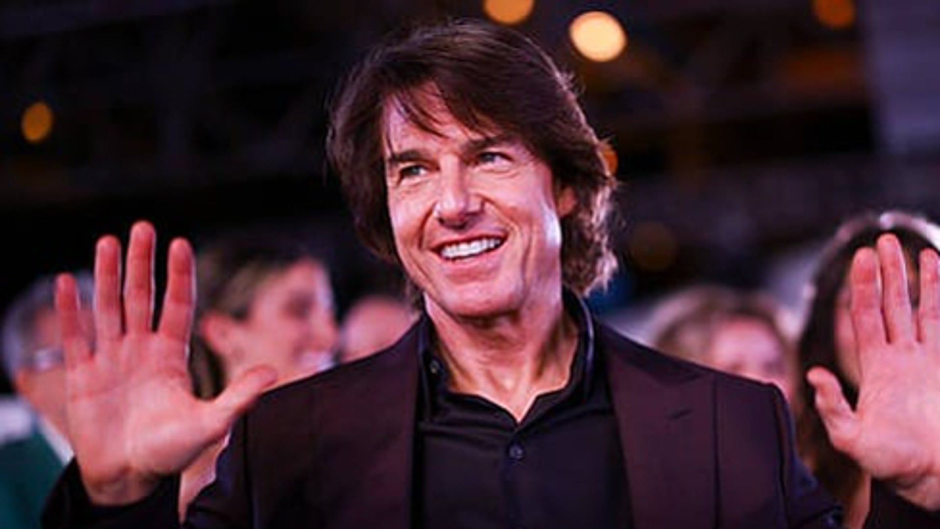 Tom Cruise sets world record for 16 burning skydiving jumps